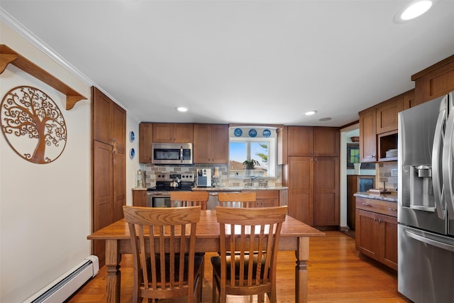 dining area with baseboard heating, recessed lighting, and light wood-type flooring