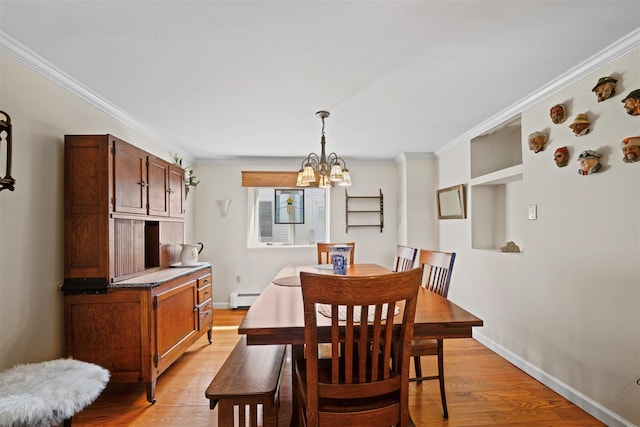 dining area with a baseboard heating unit, light wood finished floors, a chandelier, crown molding, and baseboards