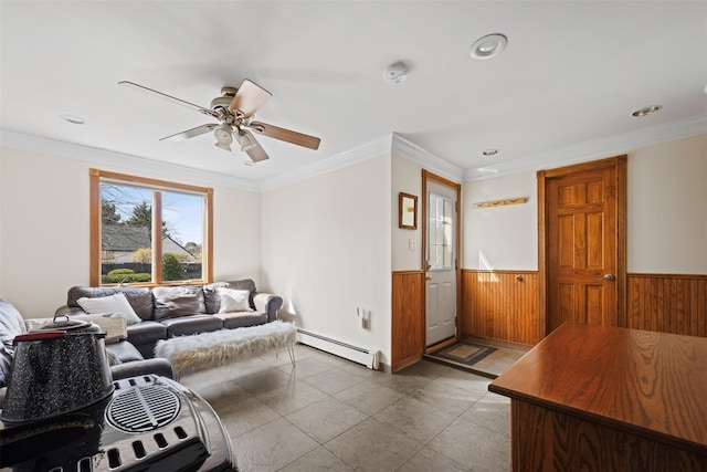 living area featuring a wainscoted wall, a baseboard heating unit, wooden walls, recessed lighting, and a ceiling fan
