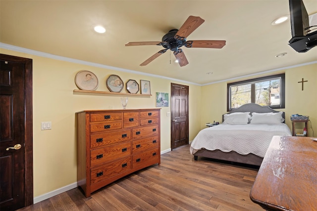 bedroom featuring hardwood / wood-style floors, baseboards, and recessed lighting