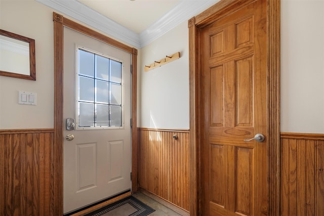 doorway to outside featuring wooden walls and wainscoting