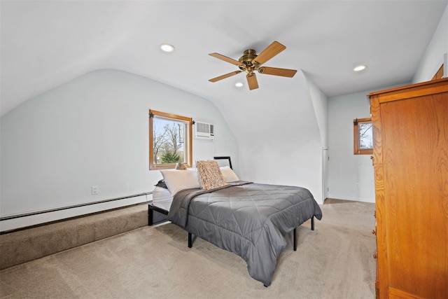 bedroom with light colored carpet, a baseboard heating unit, vaulted ceiling, multiple windows, and a wall mounted AC
