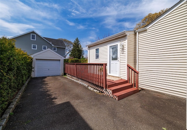 detached garage featuring driveway