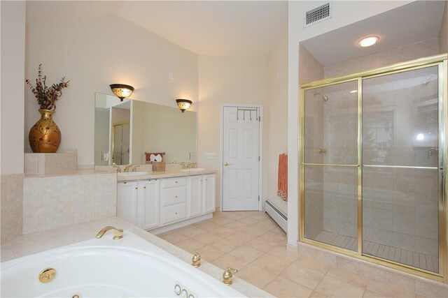 bathroom featuring a sink, a whirlpool tub, baseboard heating, and a stall shower