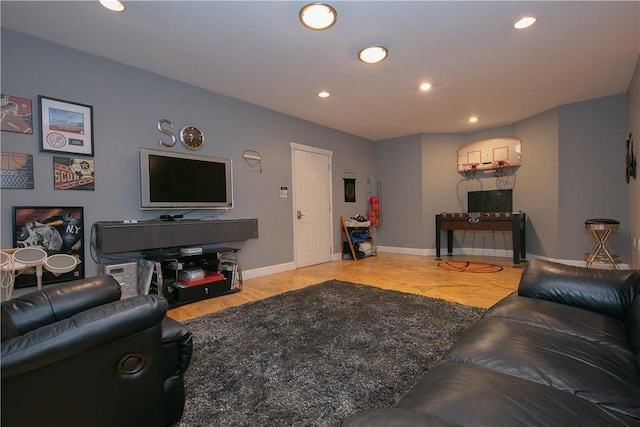 living area featuring recessed lighting, baseboards, and wood finished floors