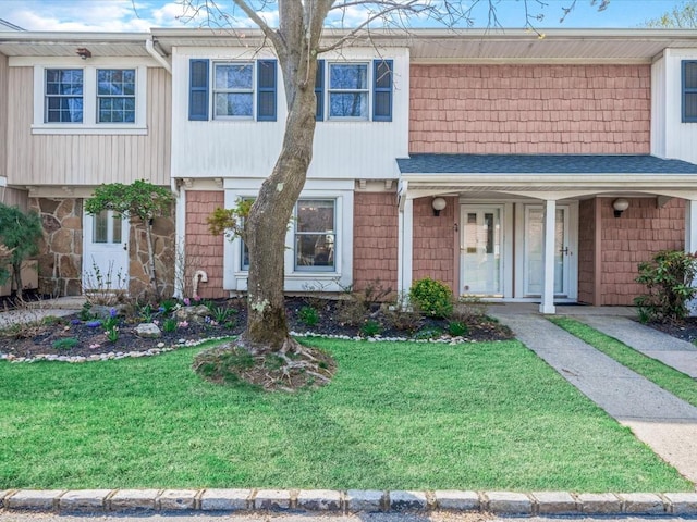 54 Hidden Ridge Dr, Syosset, NY 11791 - view of property with a front lawn, stone siding, and covered porch