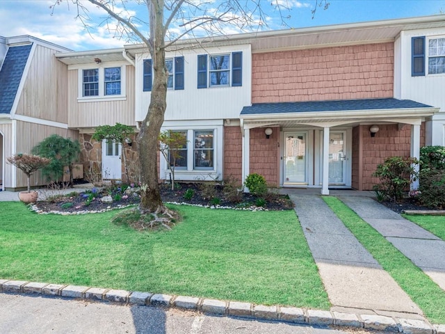 54 Hidden Ridge Dr, Syosset, NY 11791 - view of property with stone siding, covered porch, and a front yard