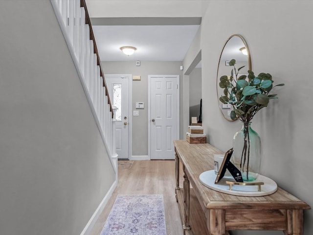 54 Hidden Ridge Dr, Syosset, NY 11791 - entrance foyer with stairway, baseboards, and light wood-type flooring