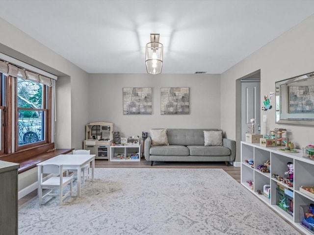 54 Hidden Ridge Dr, Syosset, NY 11791 - living area with baseboards, wood finished floors, and visible vents