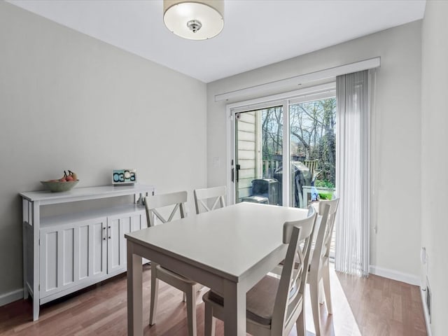 54 Hidden Ridge Dr, Syosset, NY 11791 - dining space with baseboards and wood finished floors