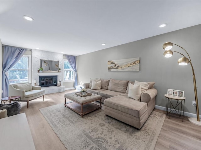 54 Hidden Ridge Dr, Syosset, NY 11791 - living room featuring a fireplace, baseboards, wood finished floors, and recessed lighting