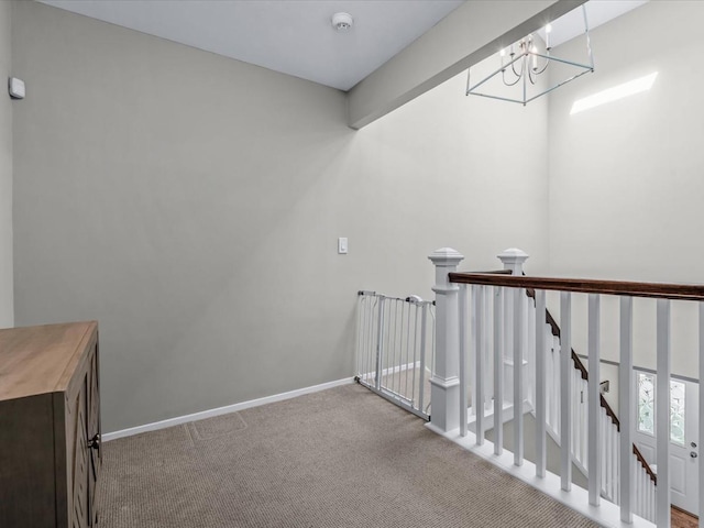 54 Hidden Ridge Dr, Syosset, NY 11791 - interior space featuring carpet floors, baseboards, a notable chandelier, and an upstairs landing