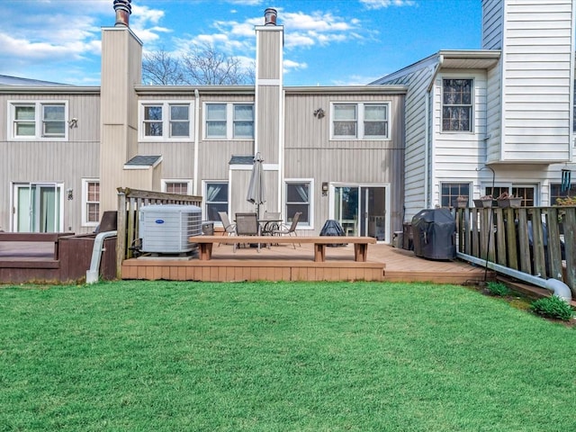 54 Hidden Ridge Dr, Syosset, NY 11791 - back of house featuring a chimney, central AC unit, a yard, and a deck