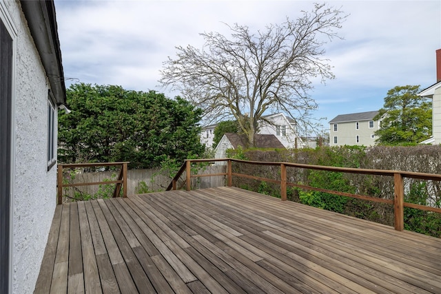 deck featuring a fenced backyard and a residential view