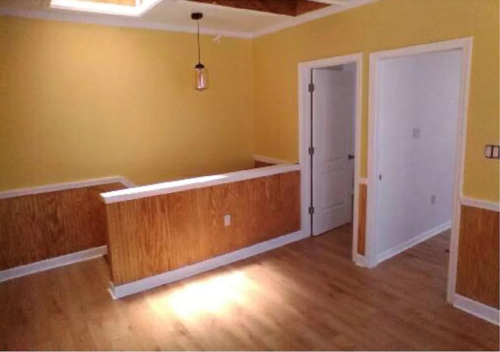 unfurnished room featuring wood finished floors