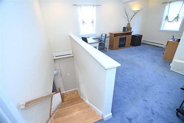 staircase with a baseboard radiator