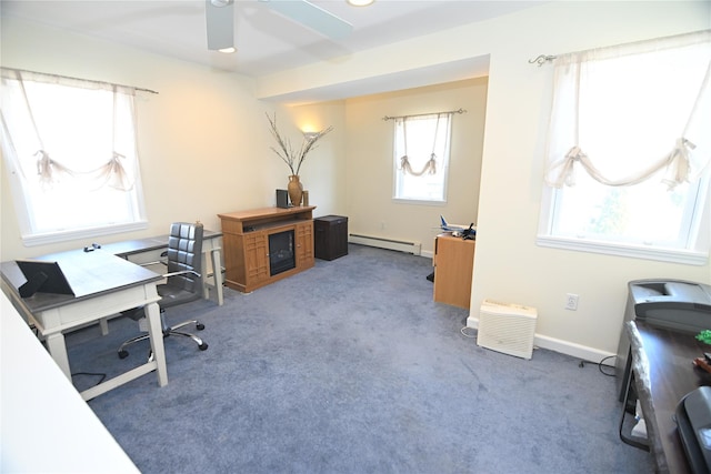 office with baseboard heating, ceiling fan, baseboards, and carpet