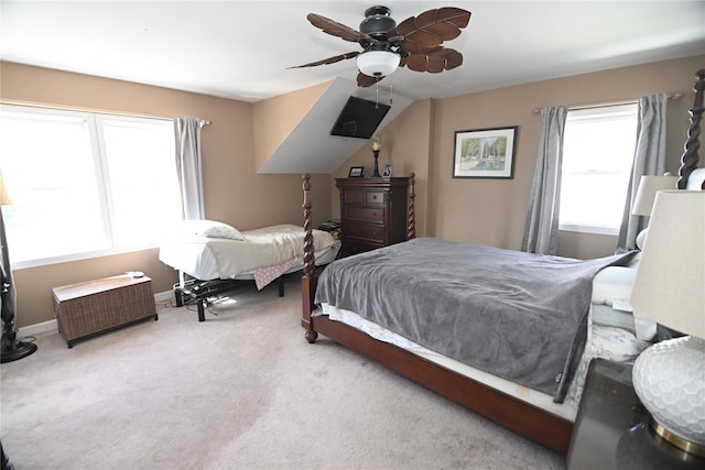 bedroom with ceiling fan, baseboards, and carpet flooring
