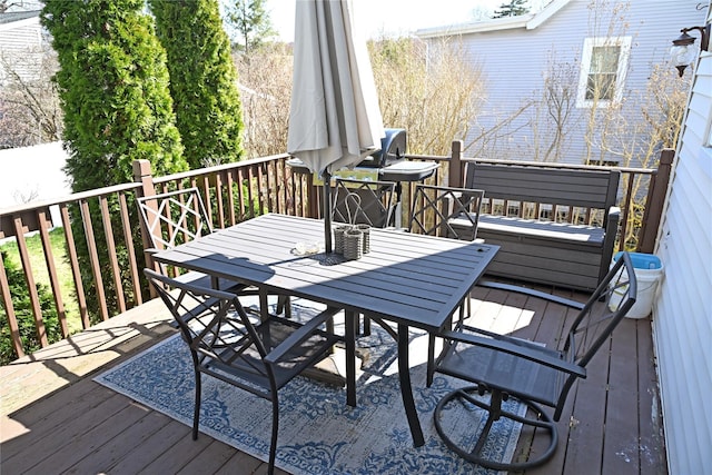 deck featuring outdoor dining area