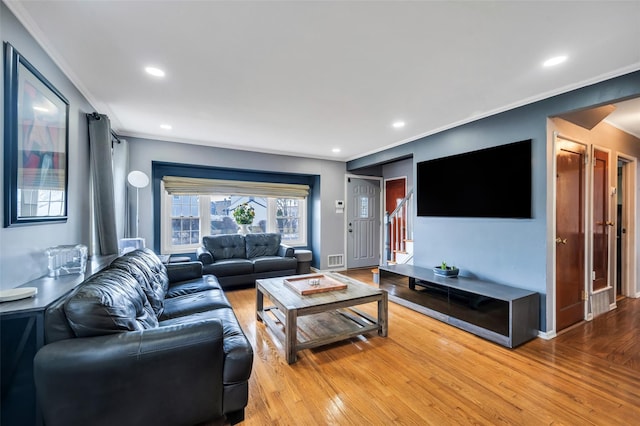 living area with recessed lighting, wood finished floors, and ornamental molding