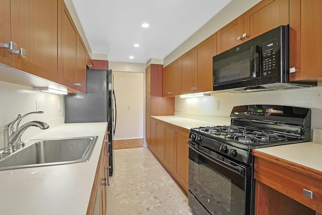 1270 N Ave Unit 3E, New Rochelle, NY 10804 - kitchen with black appliances, a sink, recessed lighting, light countertops, and brown cabinets