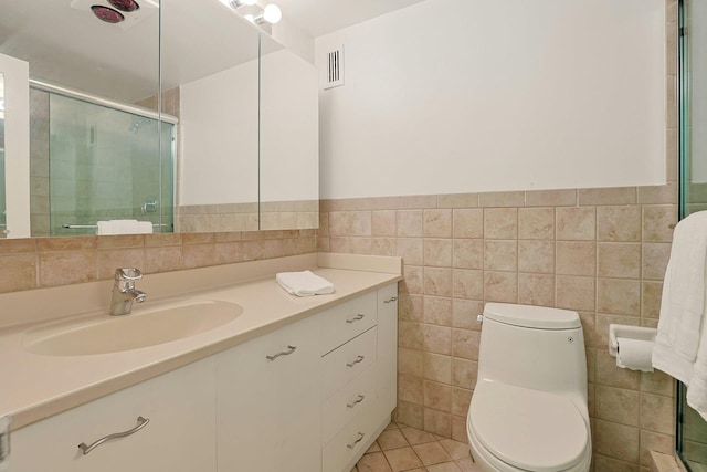 1270 N Ave Unit 3E, New Rochelle, NY 10804 - full bath with vanity, tile walls, toilet, a tile shower, and wainscoting
