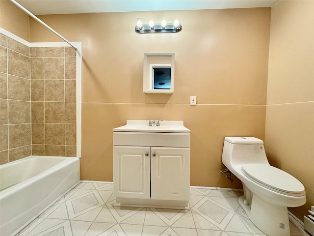 full bath featuring vanity, tile patterned flooring, shower / tub combination, and toilet