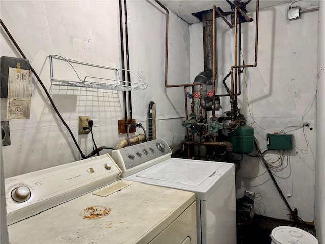 laundry room featuring washer and clothes dryer and laundry area
