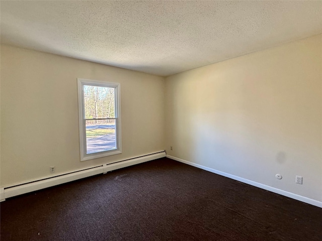 unfurnished room featuring dark carpet, baseboard heating, baseboards, and a textured ceiling
