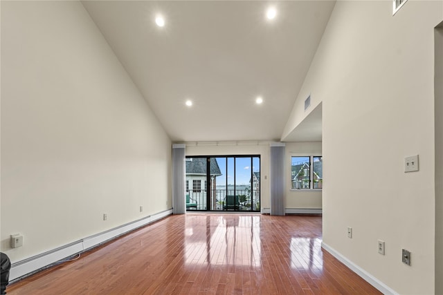 120-06 Riviera Ct Unit 17B, College Point, NY 11356 - unfurnished room with a baseboard heating unit, hardwood / wood-style floors, high vaulted ceiling, recessed lighting, and baseboards