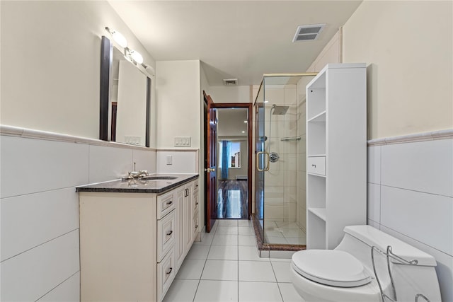 120-06 Riviera Ct Unit 17B, College Point, NY 11356 - bathroom with toilet, a shower stall, vanity, tile patterned flooring, and a wainscoted wall