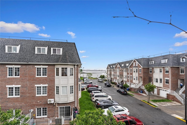 120-06 Riviera Ct Unit 17B, College Point, NY 11356 - view of building exterior featuring uncovered parking and a residential view
