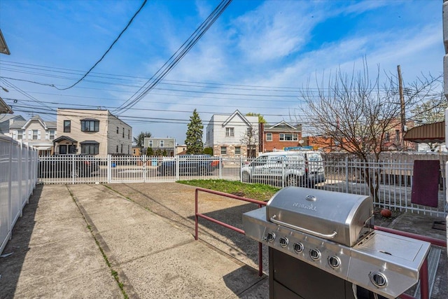 6147 Grand Ave, Maspeth, NY 11378 - view of patio / terrace featuring fence and a residential view