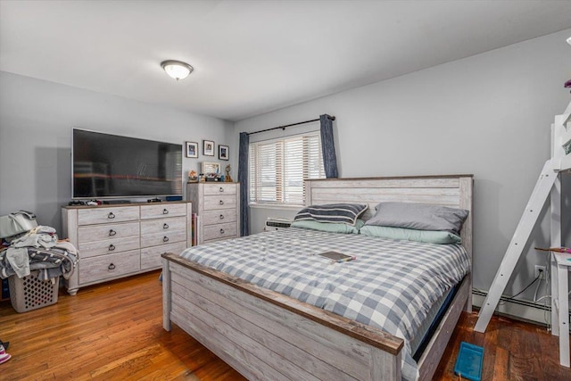 6147 Grand Ave, Maspeth, NY 11378 - bedroom featuring baseboard heating and wood finished floors