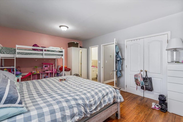6147 Grand Ave, Maspeth, NY 11378 - bedroom with a closet and wood finished floors