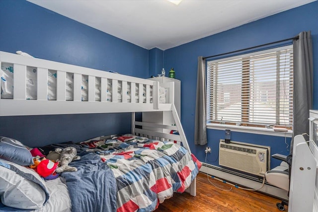 6147 Grand Ave, Maspeth, NY 11378 - bedroom with an AC wall unit and wood finished floors