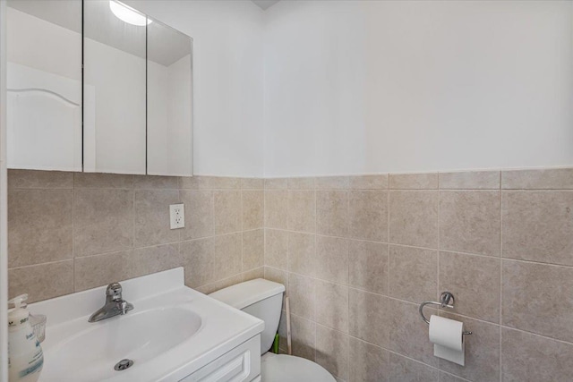 6147 Grand Ave, Maspeth, NY 11378 - bathroom with tile walls, toilet, and vanity