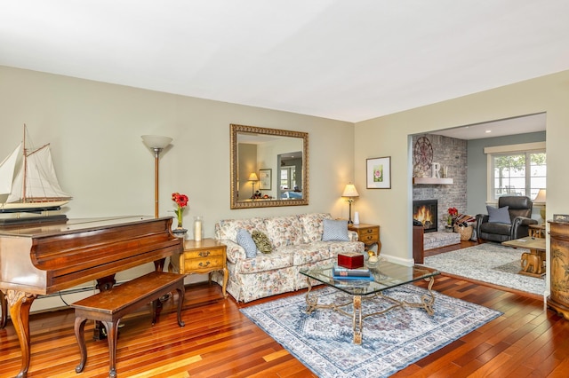 living area with a fireplace and hardwood / wood-style flooring