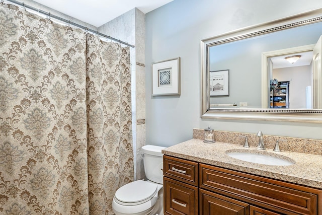 bathroom with vanity, toilet, and a shower with curtain