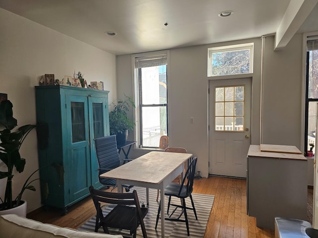 dining space with recessed lighting, light wood-style flooring, and a healthy amount of sunlight