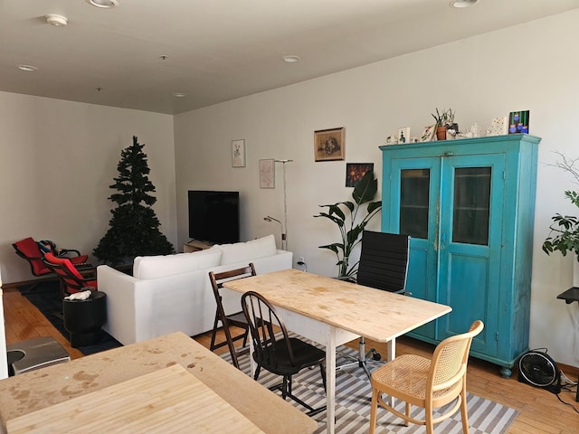 dining room featuring recessed lighting and light wood-style flooring