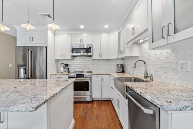 kitchen featuring a sink, white cabinets, and appliances with stainless steel finishes