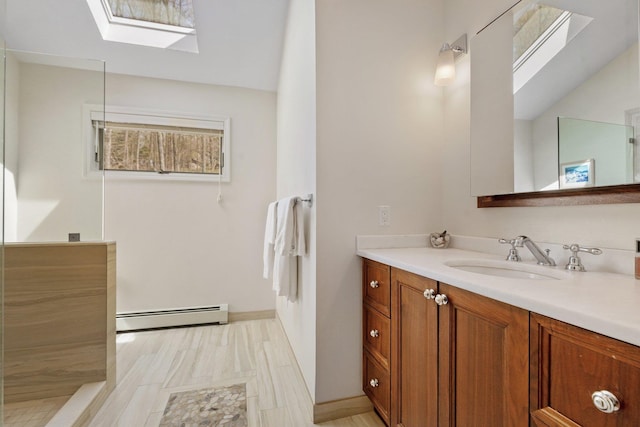 full bath with baseboard heating, baseboards, lofted ceiling with skylight, and vanity
