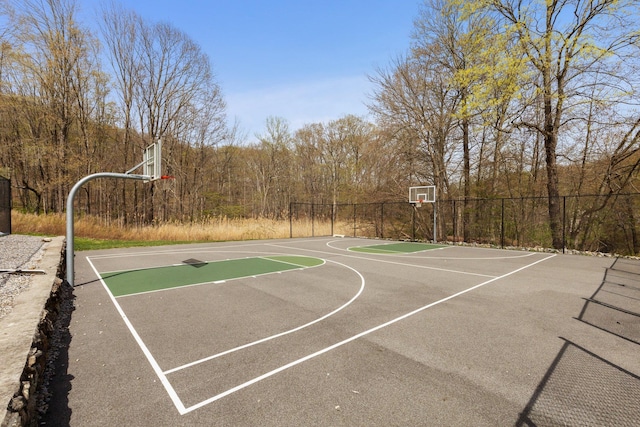 view of sport court featuring fence and community basketball court