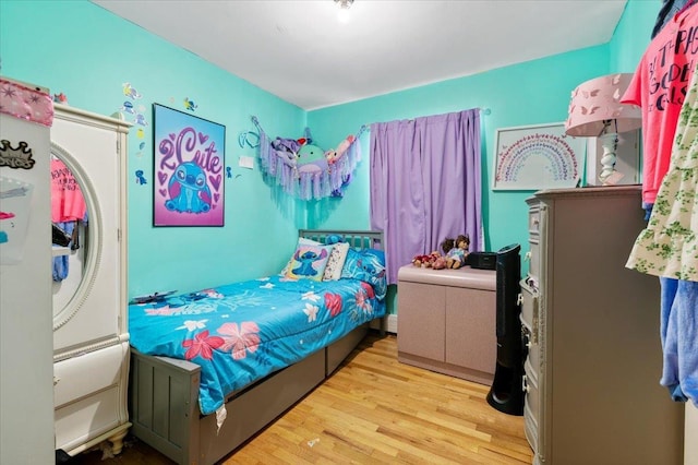 bedroom with wood finished floors