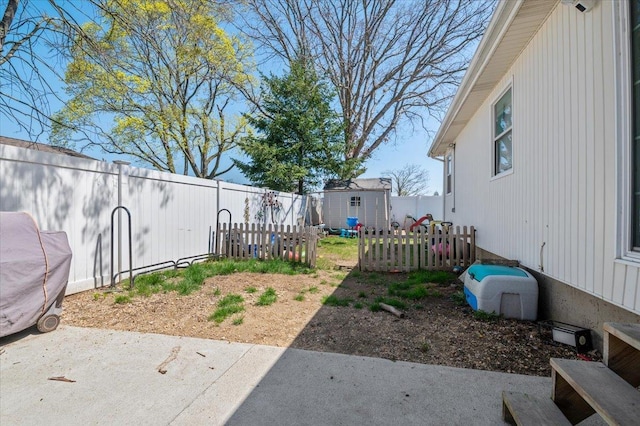 view of yard with an outdoor structure, a patio, a storage shed, and a fenced backyard
