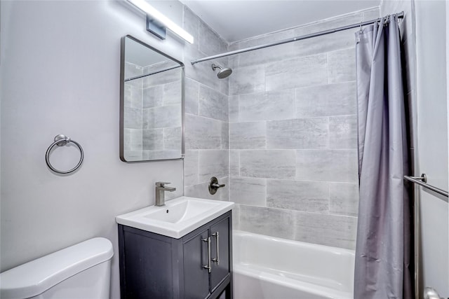 full bath featuring vanity, toilet, and shower / bath combo