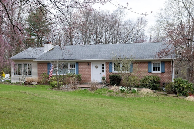 125 Tick Tock Way, Stanfordville, NY 12581 - ranch-style home featuring brick siding, a chimney, a front lawn, and roof with shingles