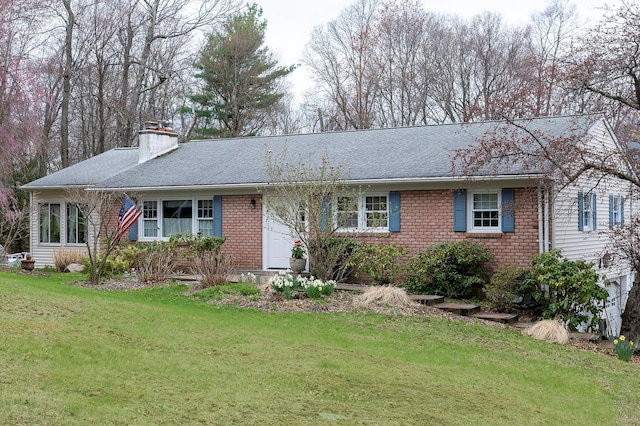125 Tick Tock Way, Stanfordville, NY 12581 - ranch-style house featuring brick siding, a front lawn, a chimney, and a shingled roof