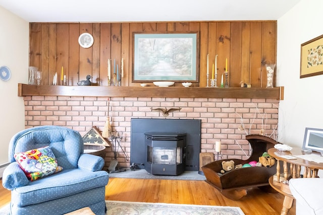 125 Tick Tock Way, Stanfordville, NY 12581 - detailed view of wood finished floors, a wood stove, and wooden walls